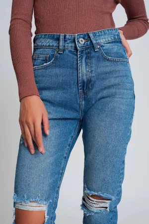 High waist mom jeans with ripped knees in dark wash blue