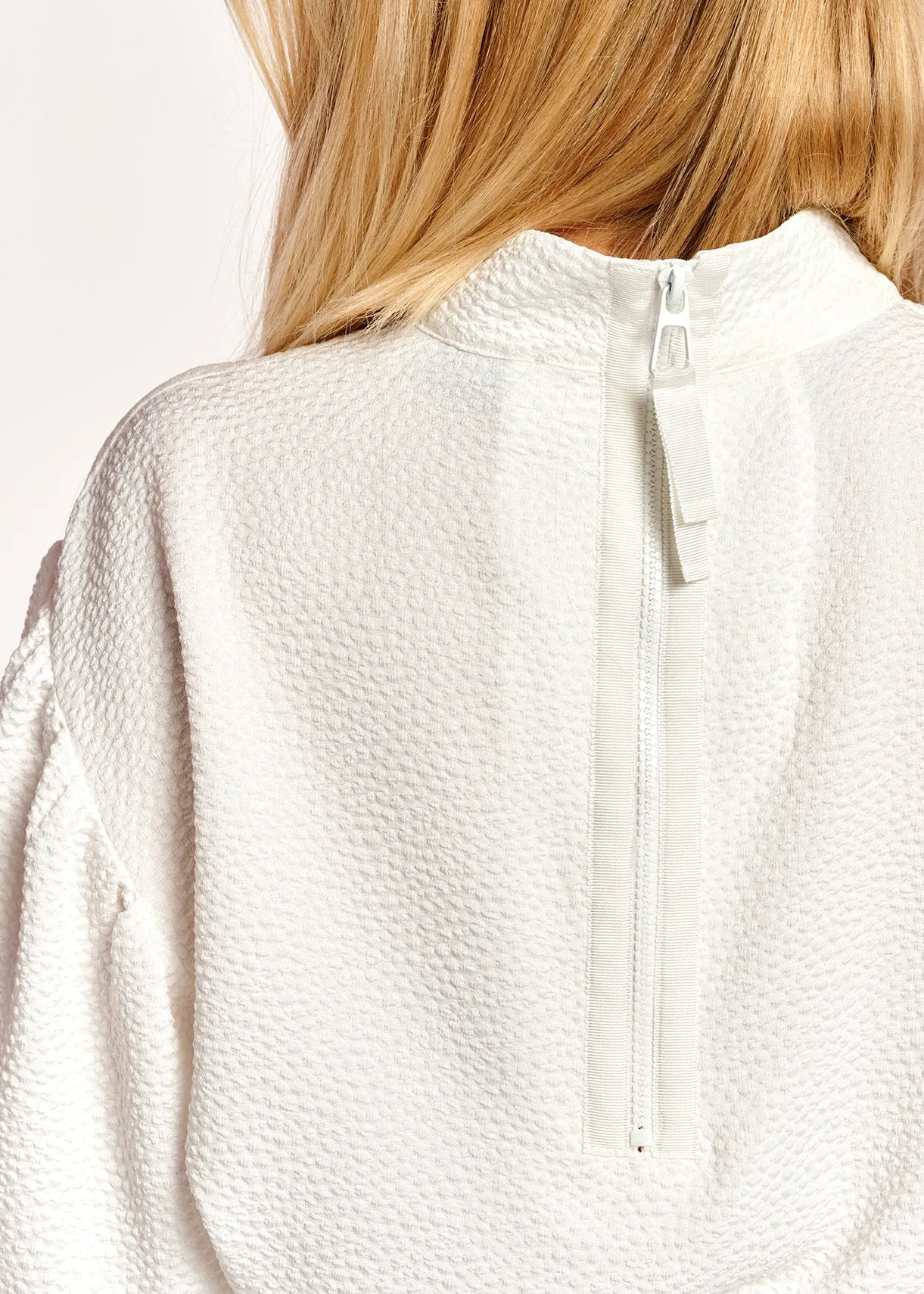 Off-white top with puffed sleeves