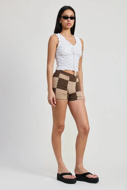 SLEEVELESS RUFFLE TOP