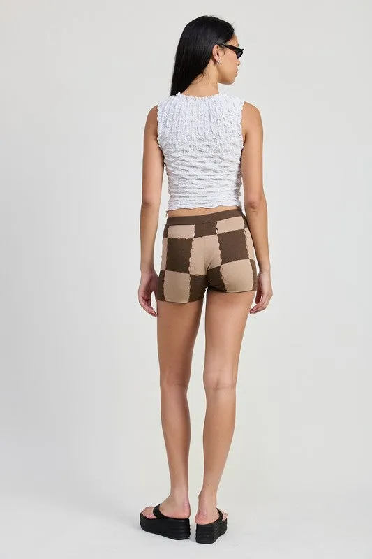 SLEEVELESS RUFFLE TOP